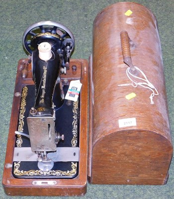 Lot 2117 - A cased Singer sewing machine.