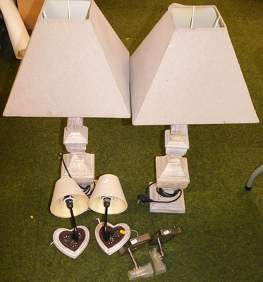 Lot 2130 - A pair of limed oak table lamps, with...