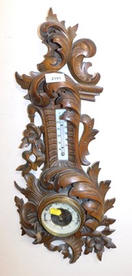 Lot 2191 - An early 20thC fruitwood carved wall barometer,...