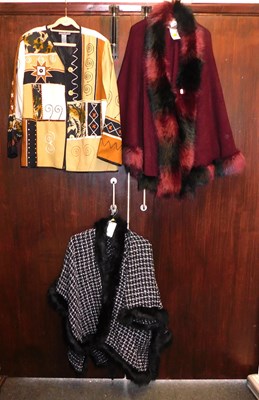 Lot 2196 - Two faux fur lined lady's ponchos, together...