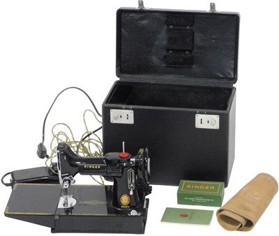 Lot 142 - A Singer portable electric sewing machine,...