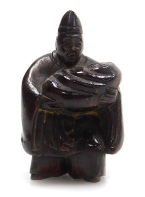 Lot 213 - A contemporary Japanese style hardwood netsuke,...