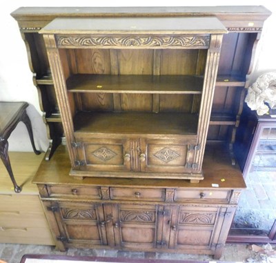 Lot 1017 - A 20thC carved oak dresser, the top with a...