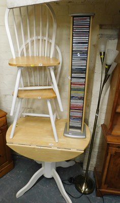 Lot 1052 - A drop leaf kitchen table, with a painted base,...