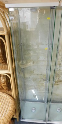 Lot 1055 - A glass pillar cabinet, with various glass...