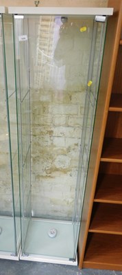 Lot 1056 - A glass pillar cabinet, with various glass...