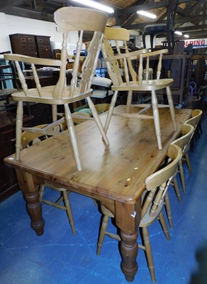 Lot 1101 - A late 20thC pine kitchen table, the top with...