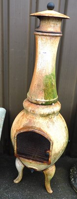 Lot 1129 - A chiminea, 127cm high.