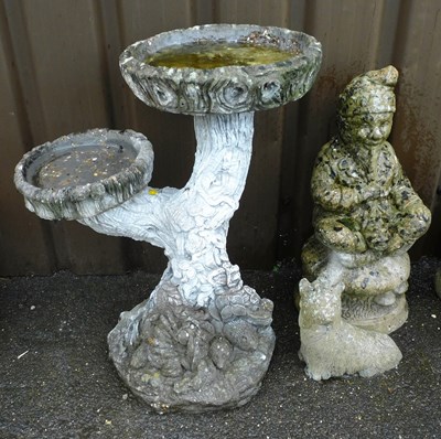 Lot 1131 - A concrete two tier garden birdbath, together...