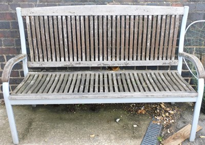 Lot 1147 - A garden bench, with wooden slatted seat and...
