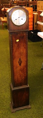Lot 2210 - An oak cased Grandmother clock, the circular...
