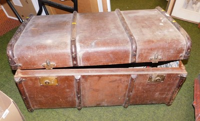 Lot 2222 - A canvas and wooden bound trunk, with leather...
