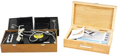 Lot 230 - A soft keyboard piano, boxed with instructions,...