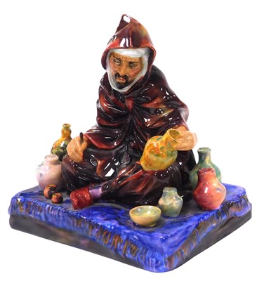 Lot 219 - A Royal Doulton figure modelled as The...