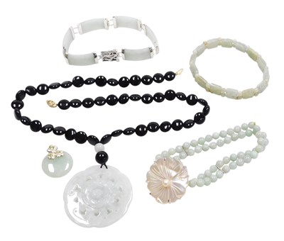 Lot 311 - A Chinese jade bracelet, of six links, capped...