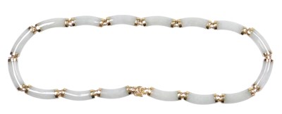 Lot 191 - A jade necklace, of sixteen links, yellow...