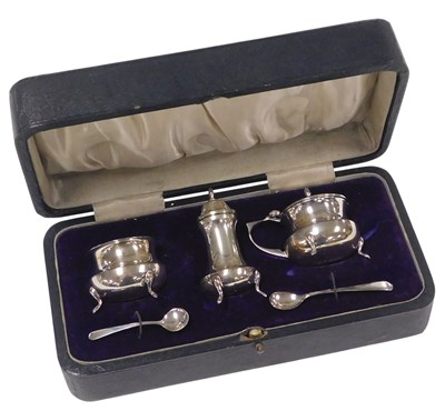 Lot 255 - A George VI silver three piece condiment...