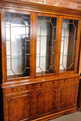 Lot 1045 - A burr wood display cabinet, the moulded top...