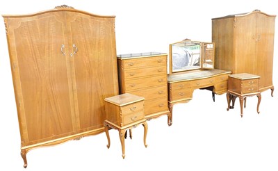 Lot 376 - A 20thC walnut bedroom suite, cross banded and...