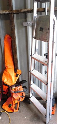 Lot 1192 - A petrol chainsaw, with canvas case, together...