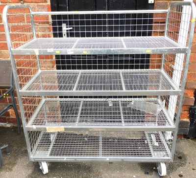 Lot 1209 - A metal four tier trolley, on castors, 137cm...