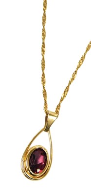 Lot 321 - A ruby drop pendant, with an oval cut ruby, in...
