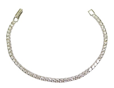 Lot 323 - A Crislu silver and cz tennis bracelet, on a...