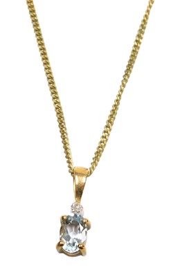 Lot 309 - A 9ct gold aquamarine and diamond pendant, on...