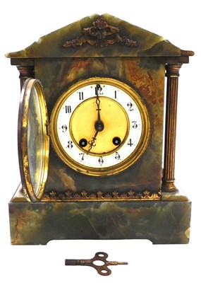 Lot 300 - A Victorian onyx cased mantel clock, circular...