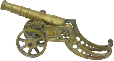 Lot 333 - A brass table canon, 45cm wide.