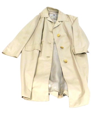 Lot 386 - An Aquascutum lady's cream full length coat.