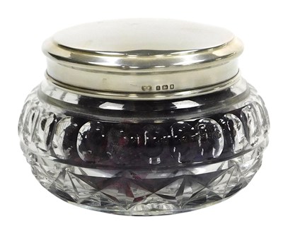 Lot 212 - A George V cut glass bowl, with a silver lid,...
