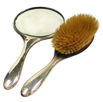 Lot 400 - A George V silver backed hand mirror and...
