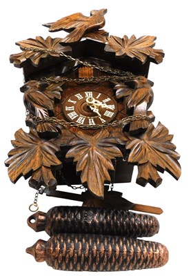 Lot 411 - A Black Forest cuckoo clock, the dial bearing...