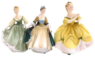 Lot 426 - Three Royal Doulton figures, comprising the...