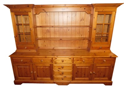 Lot 449 - A pine dresser, a breakfront moulded cornice...