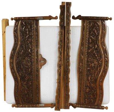 Lot 624 - A 20thC Indian carved double bed, the head and...