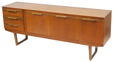 Lot 486 - A mid century teak sideboard, with a drop down...