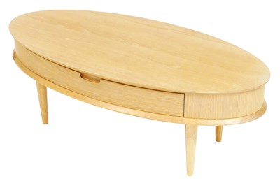 Lot 489 - A light oak oval coffee table, with a frieze...