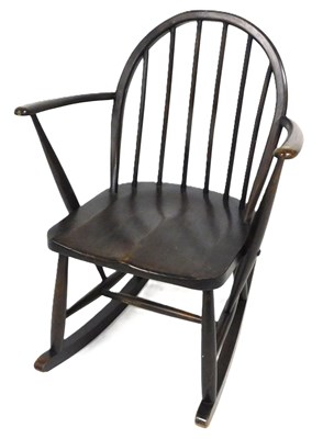 Lot 504 - An Ercol dark elm and beech Windsor child's...