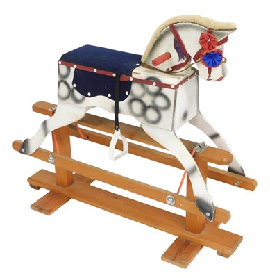 Lot 512 - A painted pine rocking horse on a cradle...