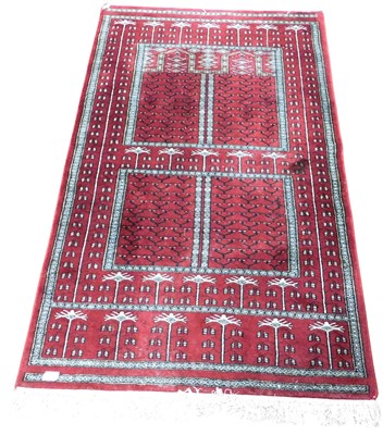 Lot 536 - A Balouch red ground prayer rug, with a...