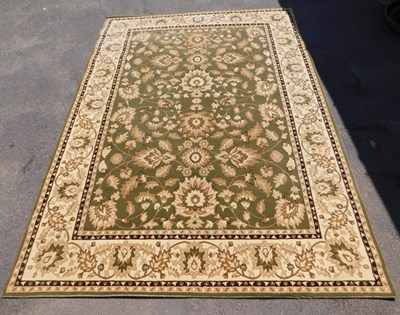Lot 540 - A Heritage Emir green ground rug, the central...