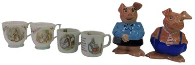 Lot 128 - Two NatWest pig money banks, together with a...
