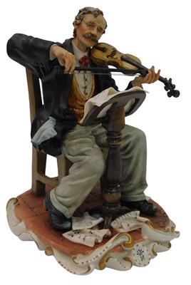 Lot 147 - A Capodimonte porcelain figure, modelled as a...