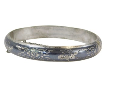 Lot 88 - A Middle Eastern design silver hinged bangle,...