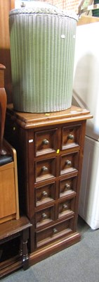 Lot 1003 - A dark stained pine chest of nine drawers,...