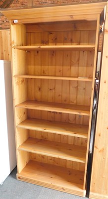 Lot 1006 - A pine bookcase, with five adjustable shelves,...
