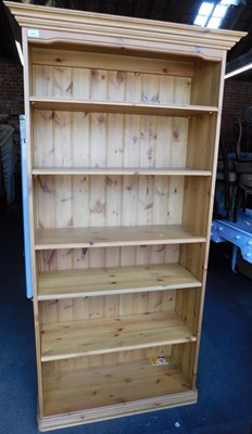 Lot 1007 - A pine bookcase of five adjustable...