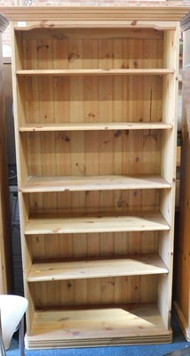 Lot 1010 - A pine bookcase with five adjustable shelves,...